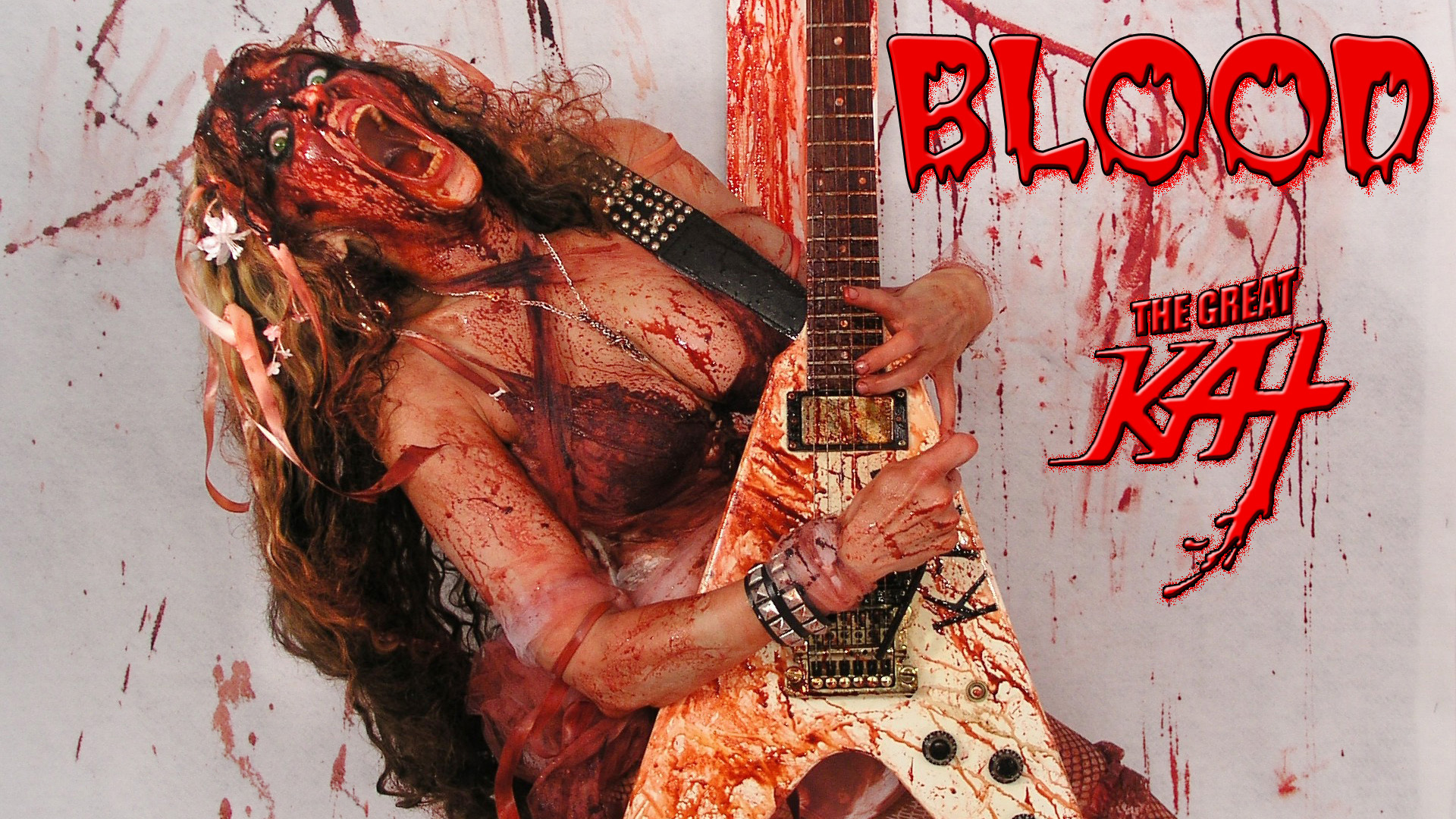 The Great Kat's BLOOD! BLOODY HORROR SHOW! Watch SHOCK ROCK Guitar Goddess The Great Kats Insane Horror Show, featuring the hot female virtuosos blood-dripping guitar shredding, heavy metal insanity & blood-curdling vocals. This is a total freak show with The Great Kats finger-bleeding guitar virtuosity and outrageous stage persona in total bloody glory! The bloodthirsty immortal guitar hero, The Great Kat gargles blood while spitting out the insanely fast guitar riffs! Let the BLOODFEST begin! 